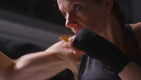 Studio-Portrait-Of-Mature-Woman-Wearing-Gym-Fitness-Clothing-Exercising-Sparring-At-Camera-3